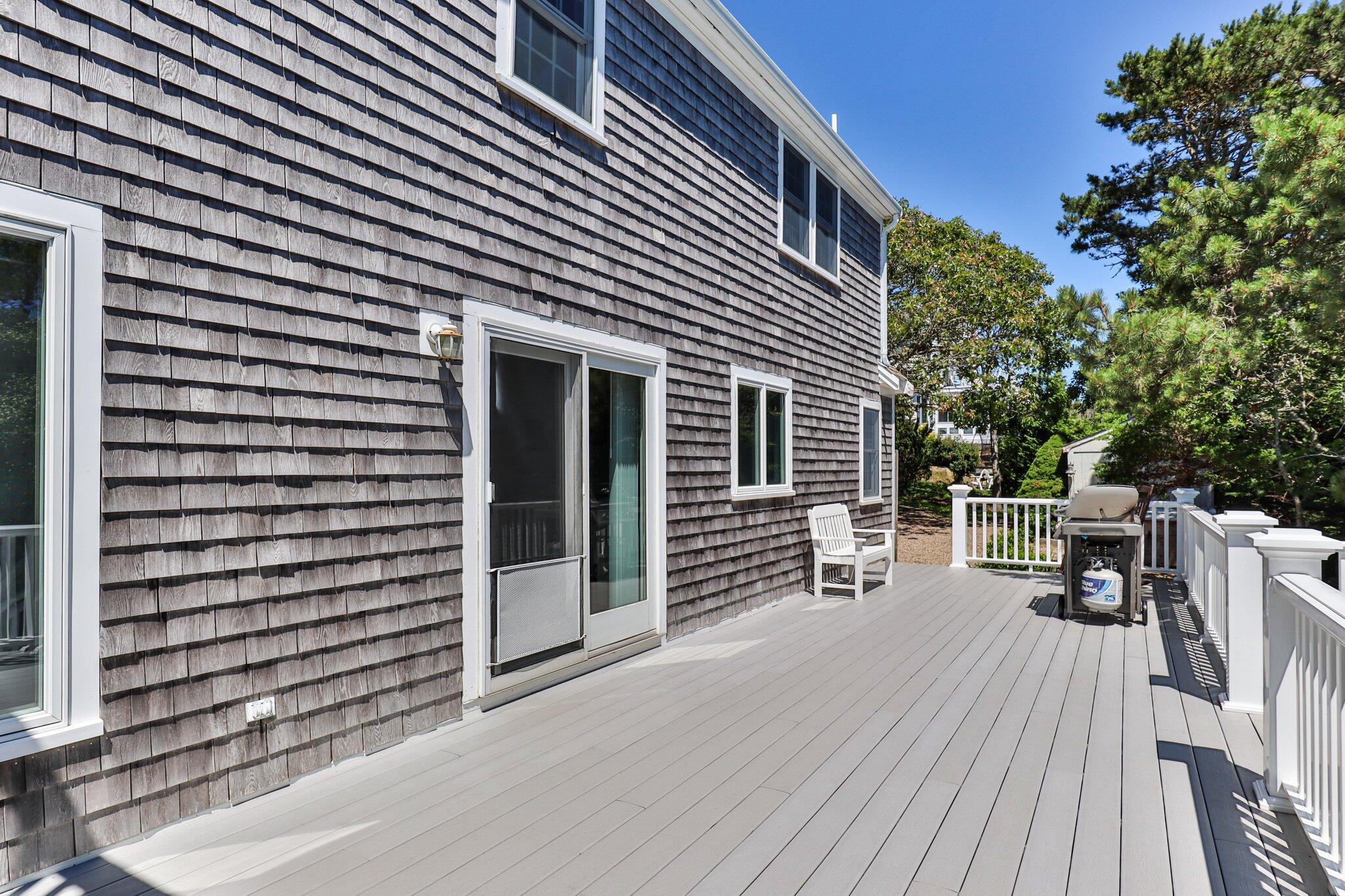 4 Portview Road Chatham, MA 02659 - Photo 51 of 69 a view of a patio with table and chairs with wooden floor and fence