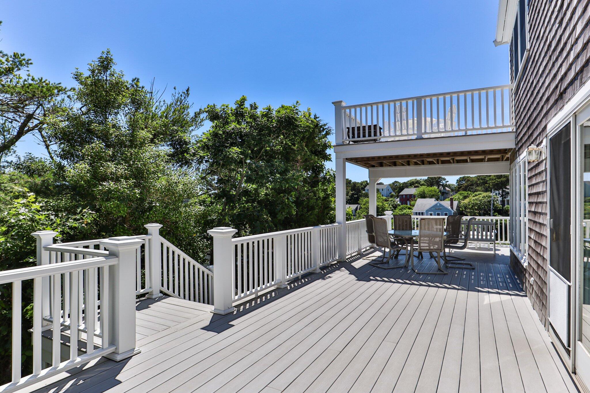 4 Portview Road Chatham, MA 02659 - Photo 54 of 69 a view of a roof deck with table and chairs and wooden floor
