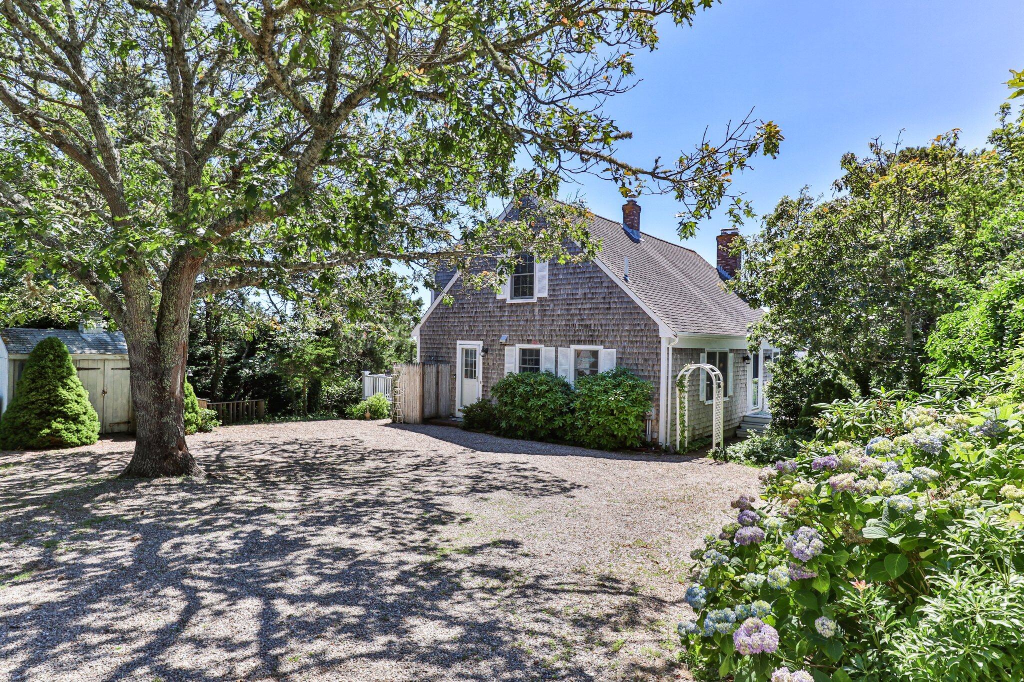 4 Portview Road Chatham, MA 02659 - Photo 6 of 69 a front view of a house with a garden
