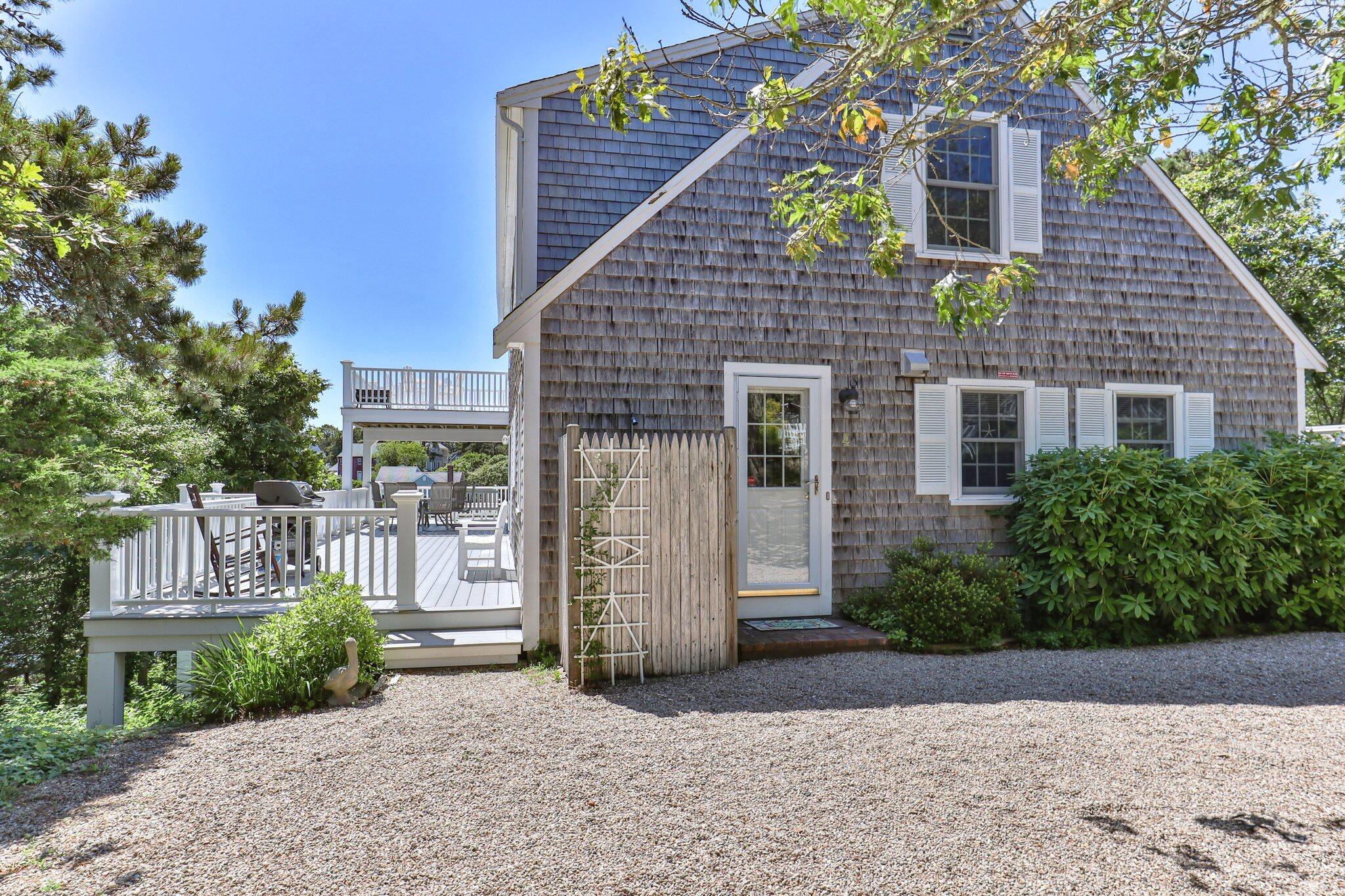 4 Portview Road Chatham, MA 02659 - Photo 63 of 69 a front view of a house with a garden