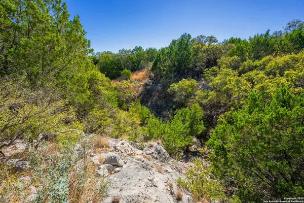 a view of a large body of water with a city view