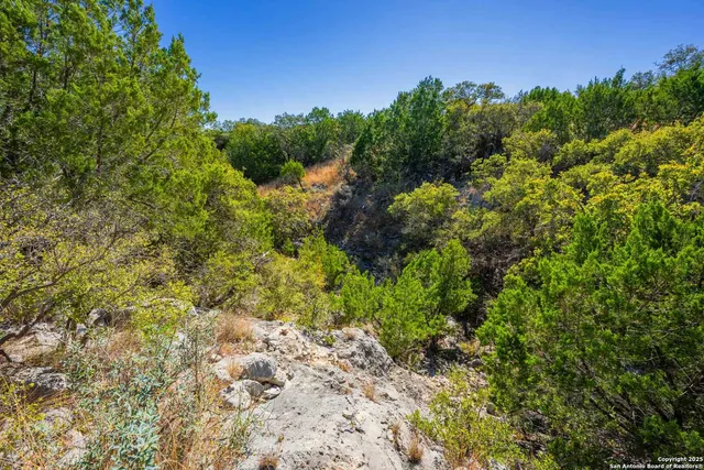 a view of a large body of water with a city view