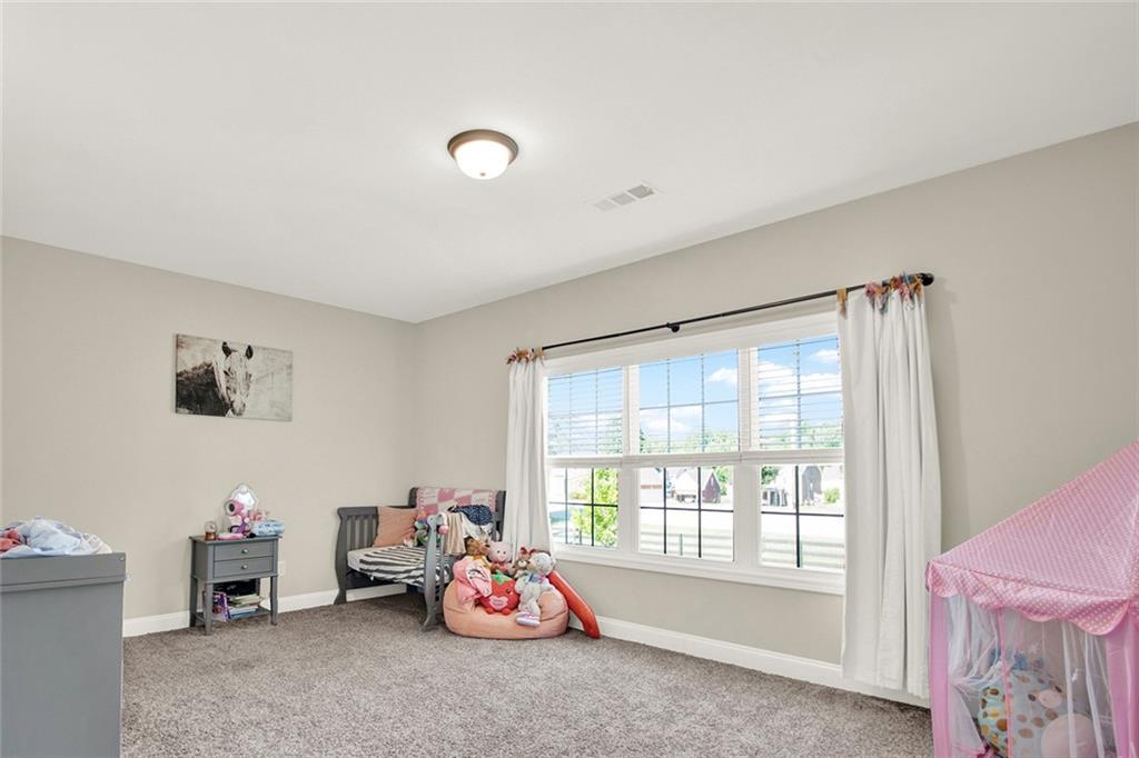 407 Corinth Church Road Winder, GA 30680 - Photo 48 of 66 a view of a room with baby toys