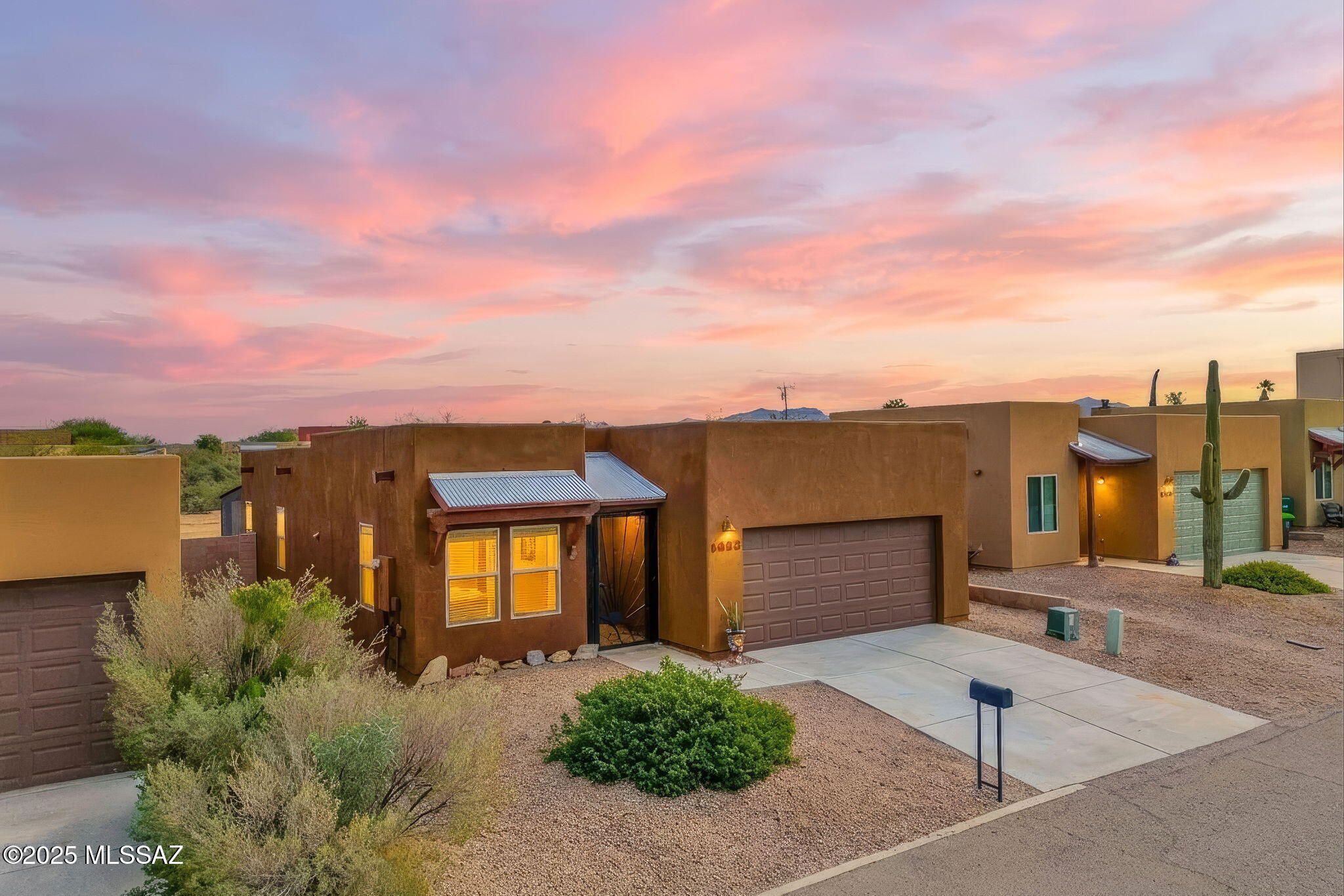 1458 North Wentworth Road Vail, AZ 85641 - Photo 1 of 44 a front view of a house with a yard
