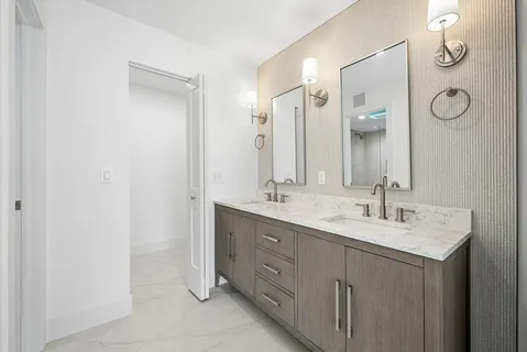 a bathroom with a shower a toilet and a sink