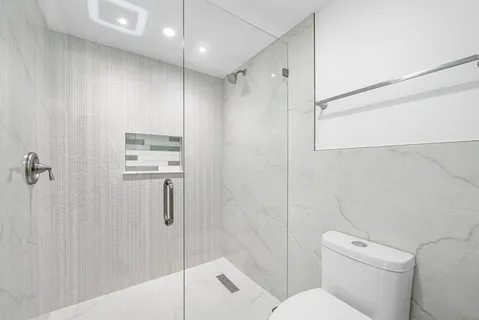 a view of a hallway with white walls