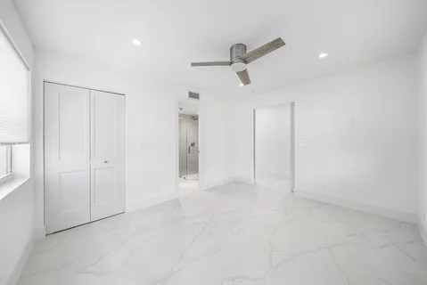 a bathroom with a toilet sink and shower