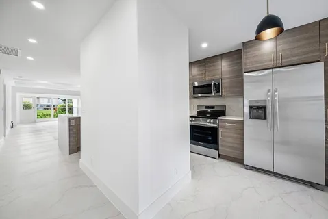 a kitchen that has a sink and a stove