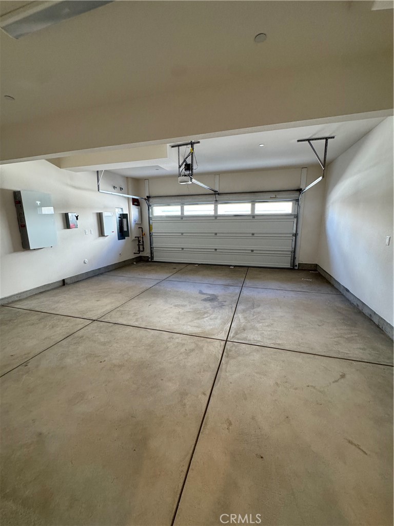 26876 Rugged Ridge Lane Valencia, CA 91381 - Photo 35 of 40 Large garage with tankless water heater, charging station and solar