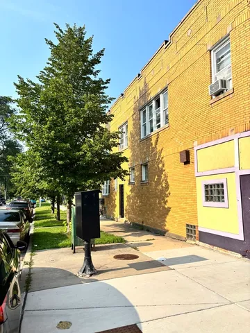a view of a building with a street