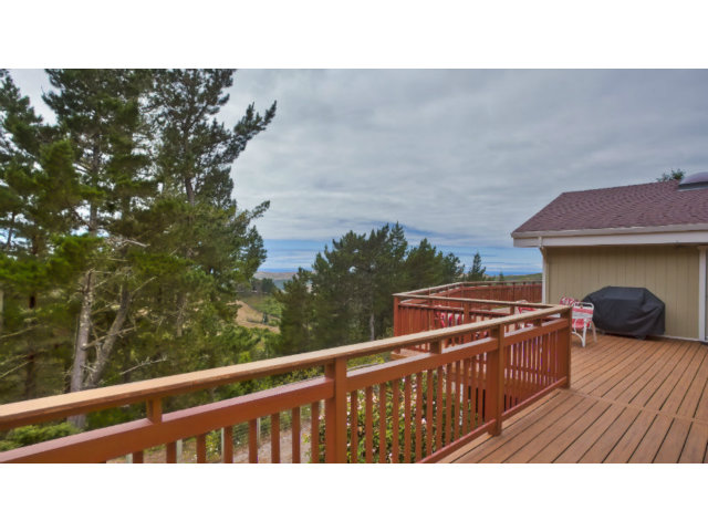 500 Irish Ridge Road Half Moon Bay, CA 94019 - Photo 8 of 25 a balcony with wooden floor and furniture