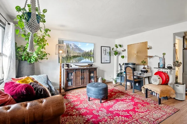 a bedroom with furniture and a potted plant