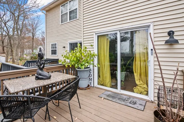 a view of a patio with table and chairs and potted plants