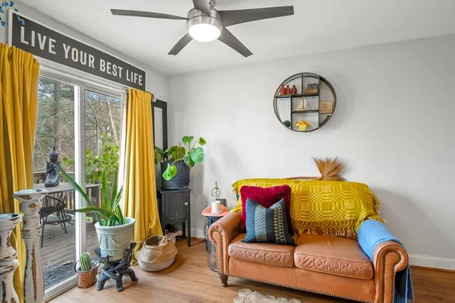 a living room with couch and a large window