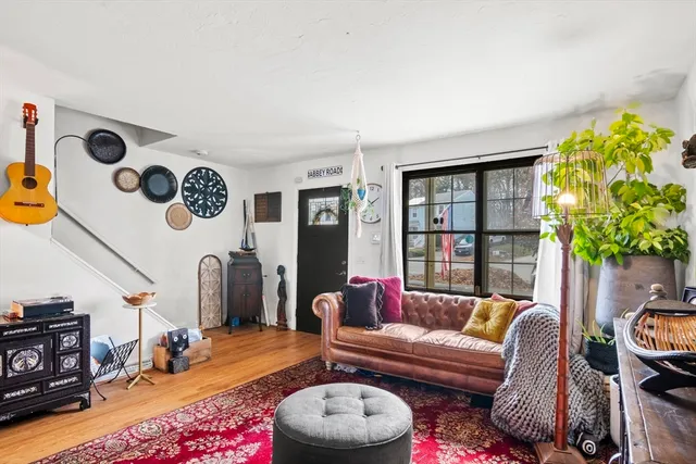 a living room with furniture and a potted plant