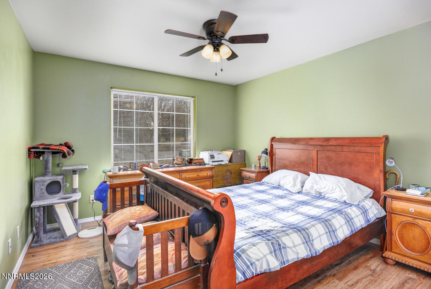 4033 Cimarron Road Fallon, NV 89406 - Photo 14 of 31 a bedroom with a bed and a chandelier