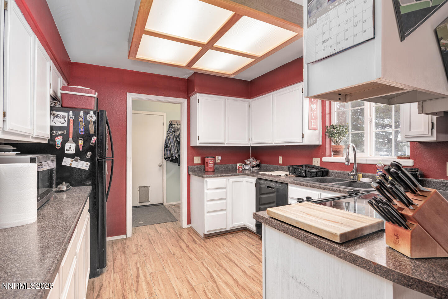 4033 Cimarron Road Fallon, NV 89406 - Photo 8 of 31 a kitchen with a stove a sink and a refrigerator