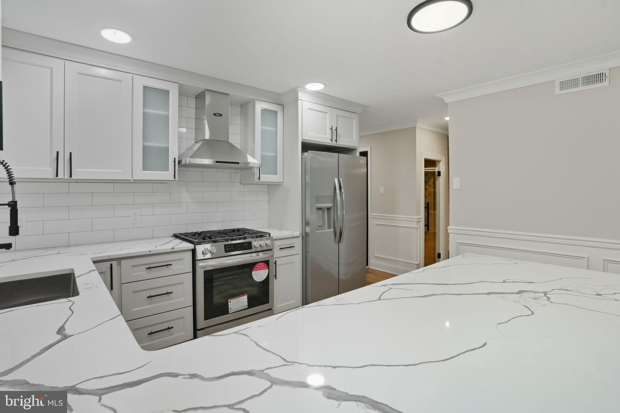 35 Church Road Elkins Park, PA 19027 - Photo 15 of 64 Sleek modern kitchen with elegant finishes.