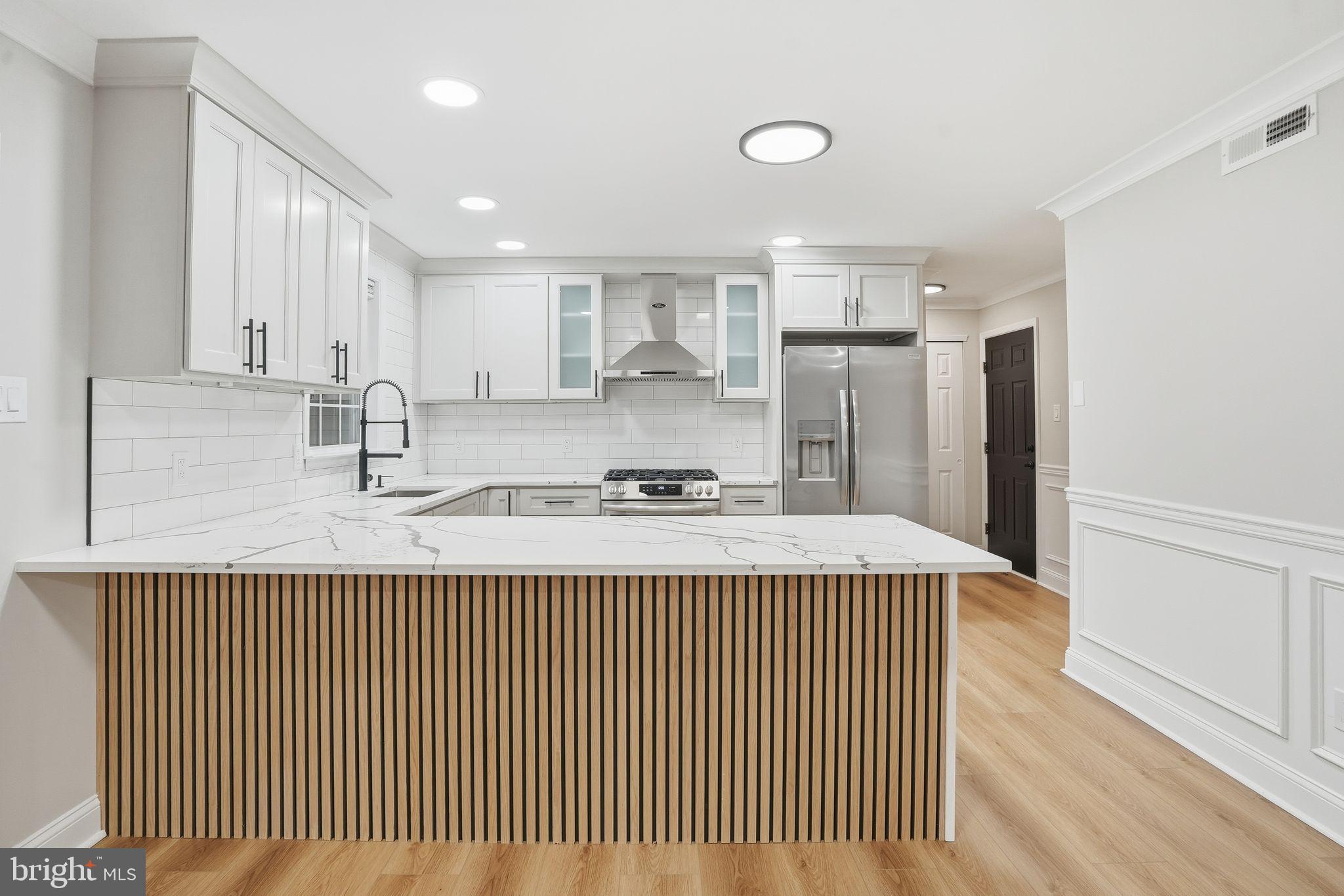 35 Church Road Elkins Park, PA 19027 - Photo 17 of 64 Sleek modern kitchen with elegant finishes.