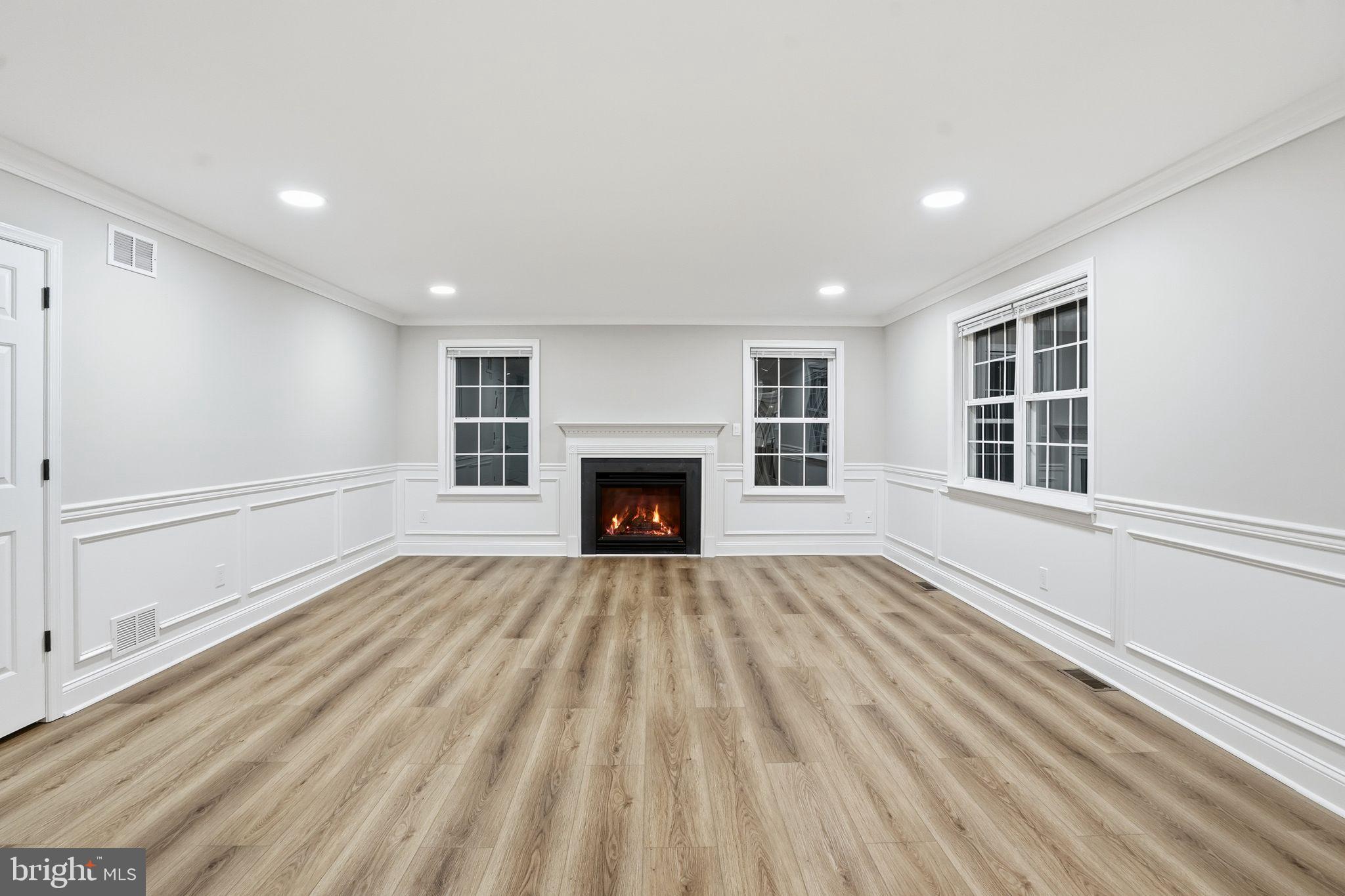 35 Church Road Elkins Park, PA 19027 - Photo 20 of 64 Bright, inviting space with a cozy fireplace.