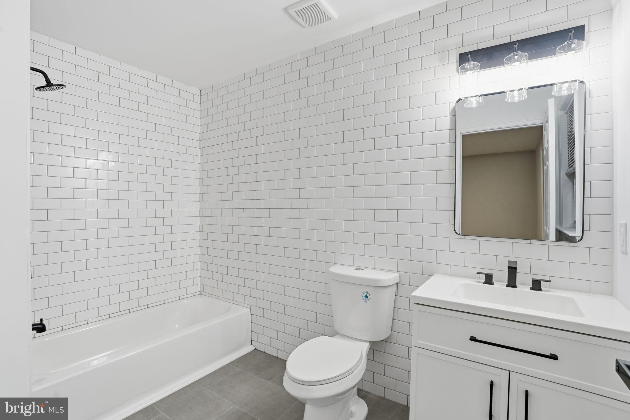 35 Church Road Elkins Park, PA 19027 - Photo 29 of 64 Modern bathroom with sleek tile design.