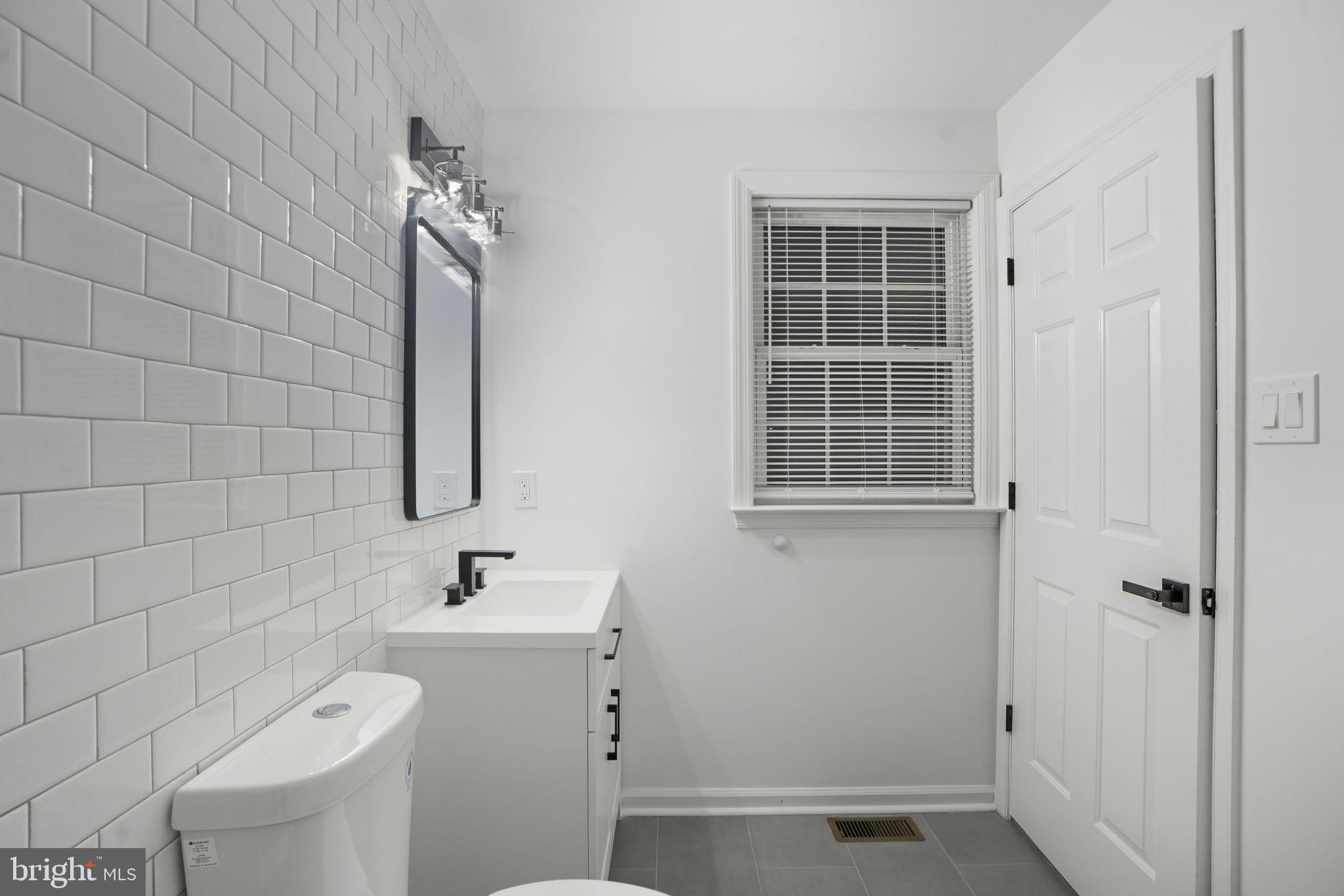 35 Church Road Elkins Park, PA 19027 - Photo 30 of 64 Sleek modern bathroom with elegant finishes.