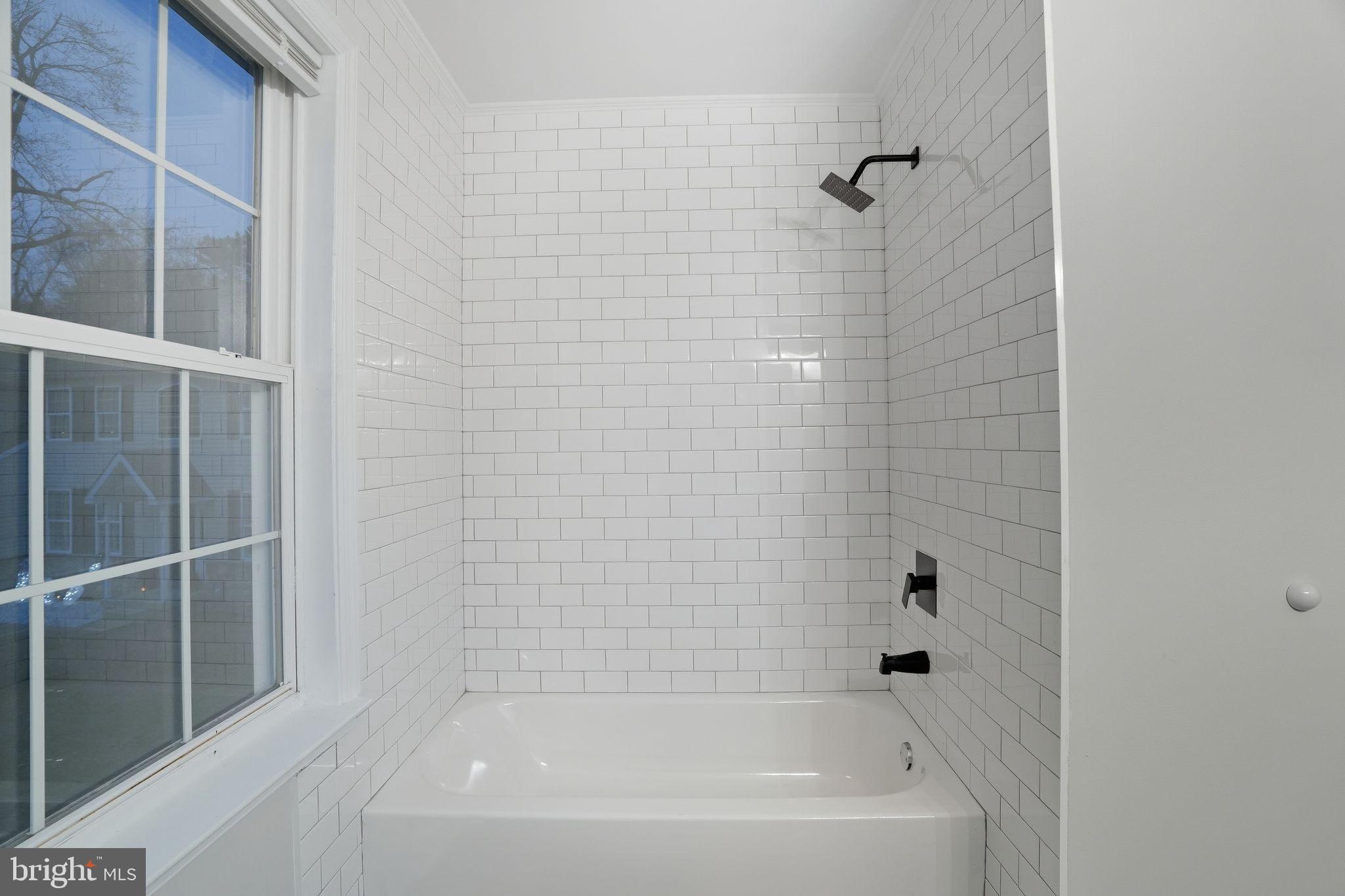 35 Church Road Elkins Park, PA 19027 - Photo 33 of 64 Sleek, modern bathroom with classic tiles.