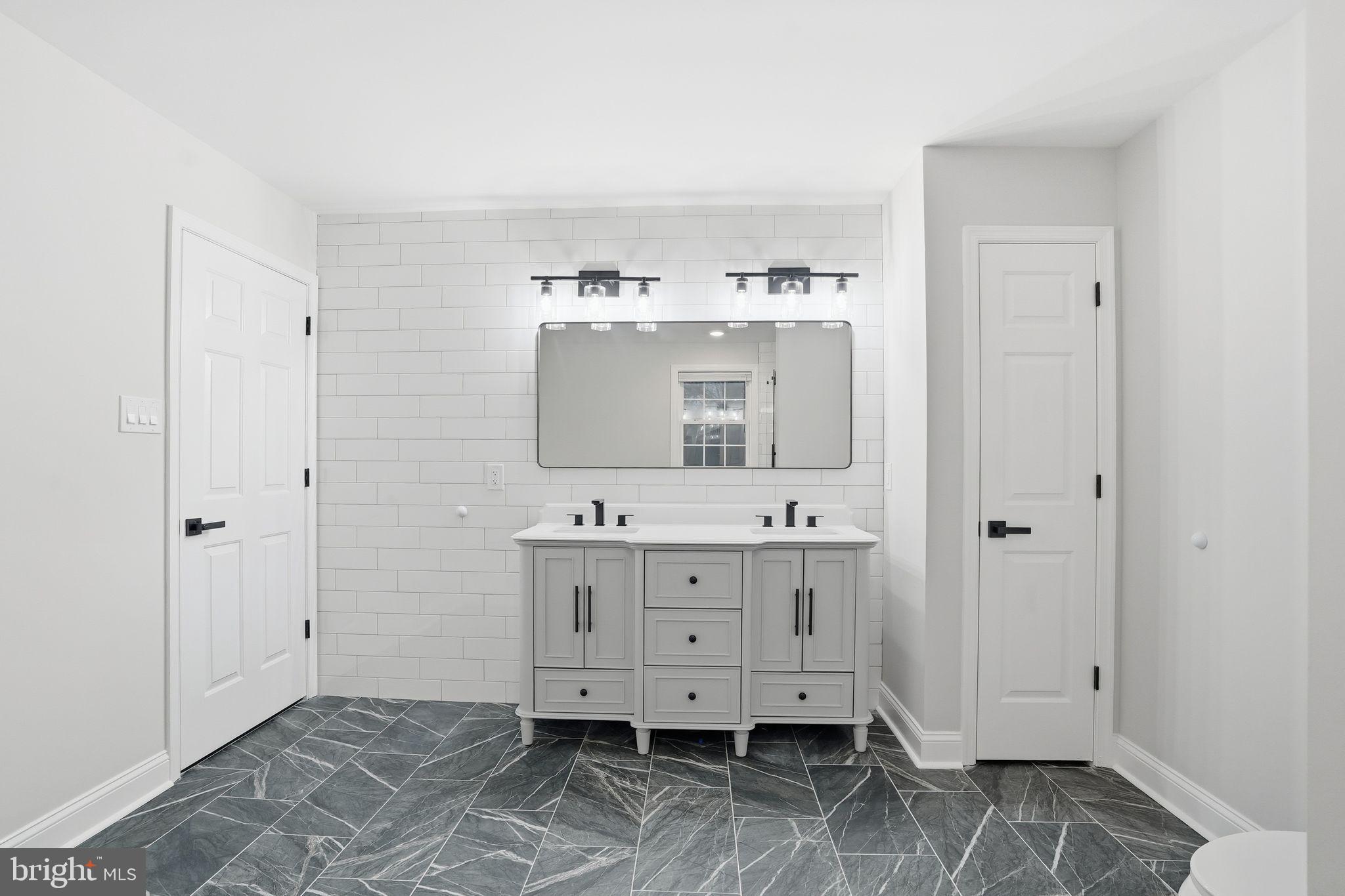35 Church Road Elkins Park, PA 19027 - Photo 48 of 64 Sleek modern bathroom with elegant finishes.