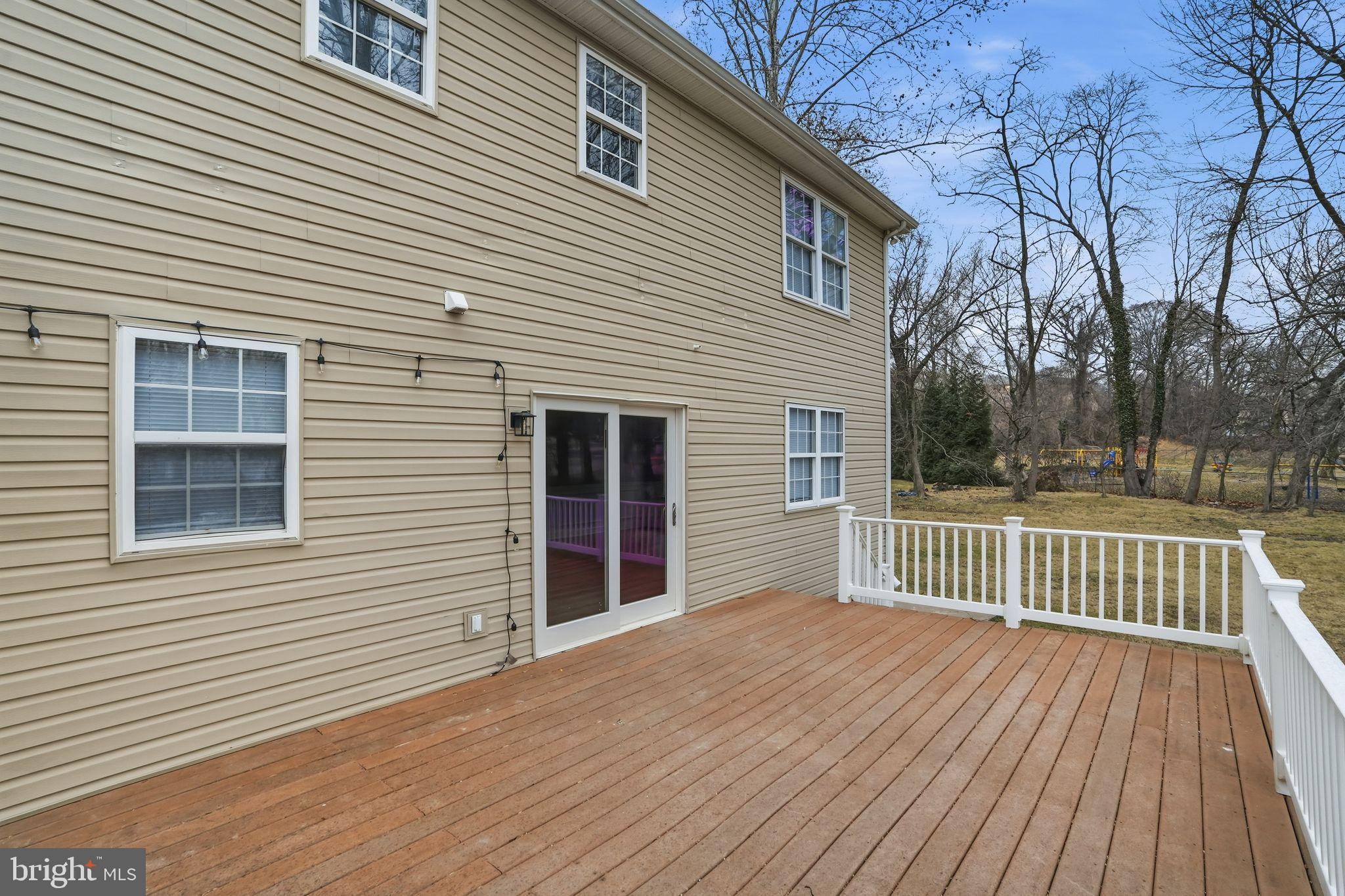 35 Church Road Elkins Park, PA 19027 - Photo 58 of 64 Spacious deck with serene backyard views.