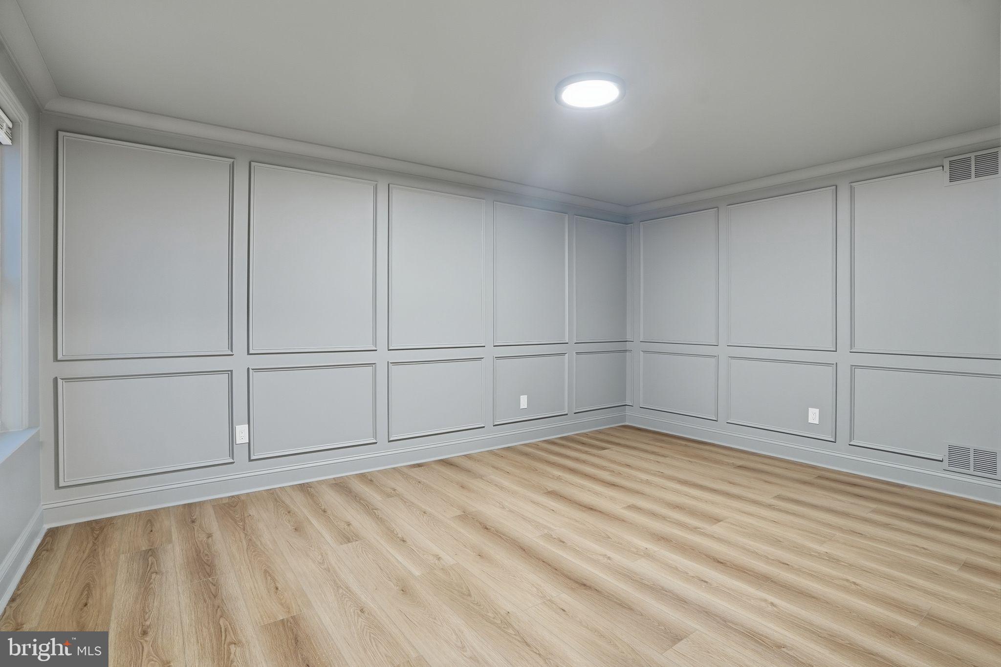 35 Church Road Elkins Park, PA 19027 - Photo 8 of 64 Elegant gray-paneled room with natural light.