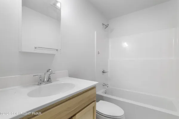 a bathroom with a sink toilet and bathtub