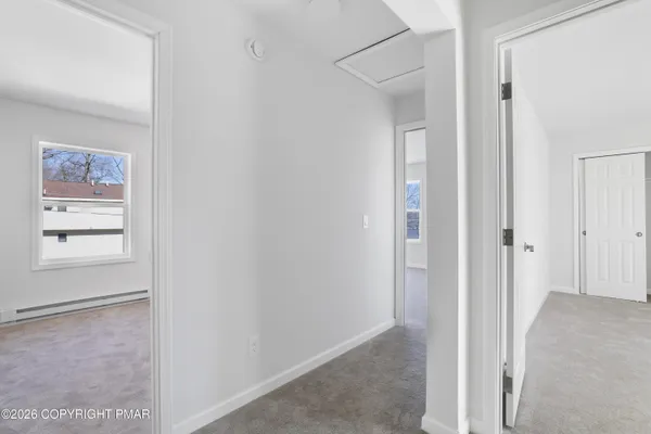 a view of a hallway with front door