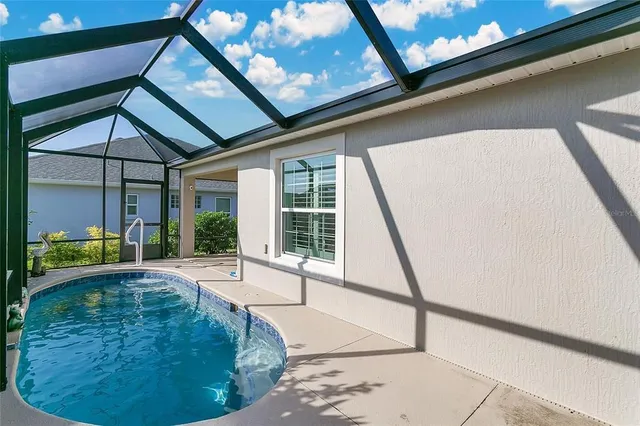 a view of a house with backyard and porch