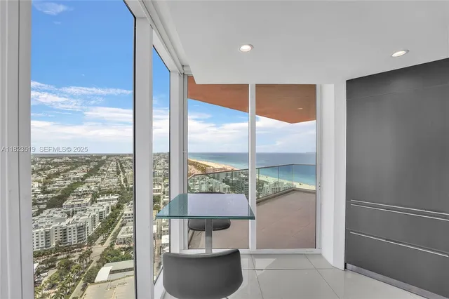 a view of hallway with a large window and painted walls