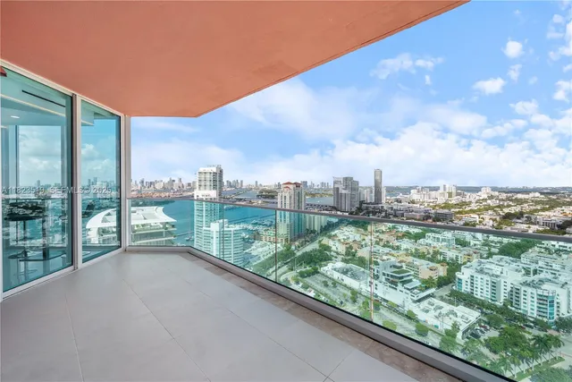 a view of a patio with couches chairs and potted plants