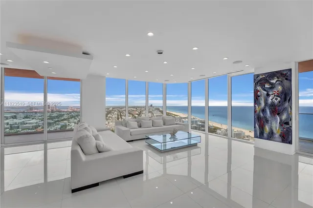 a large kitchen with stainless steel appliances lots of counter top space