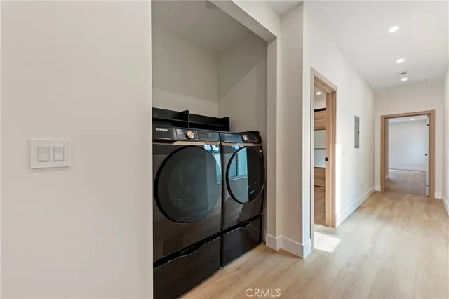a bathroom with a double vanity sink a mirror and shower
