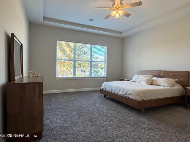 a bathroom with a sink a bathtub a mirror and a shower