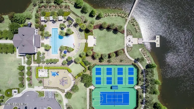 a view of a lake with a table and chairs