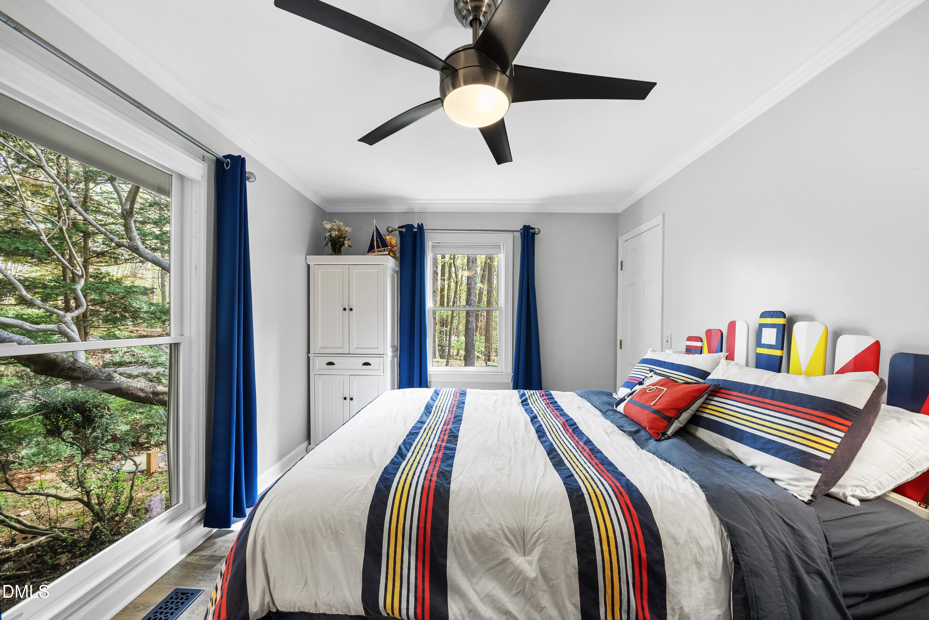 6200 Splitrock Trail Apex, NC 27539 - Photo 58 of 64 a bed room with a bed and a large window