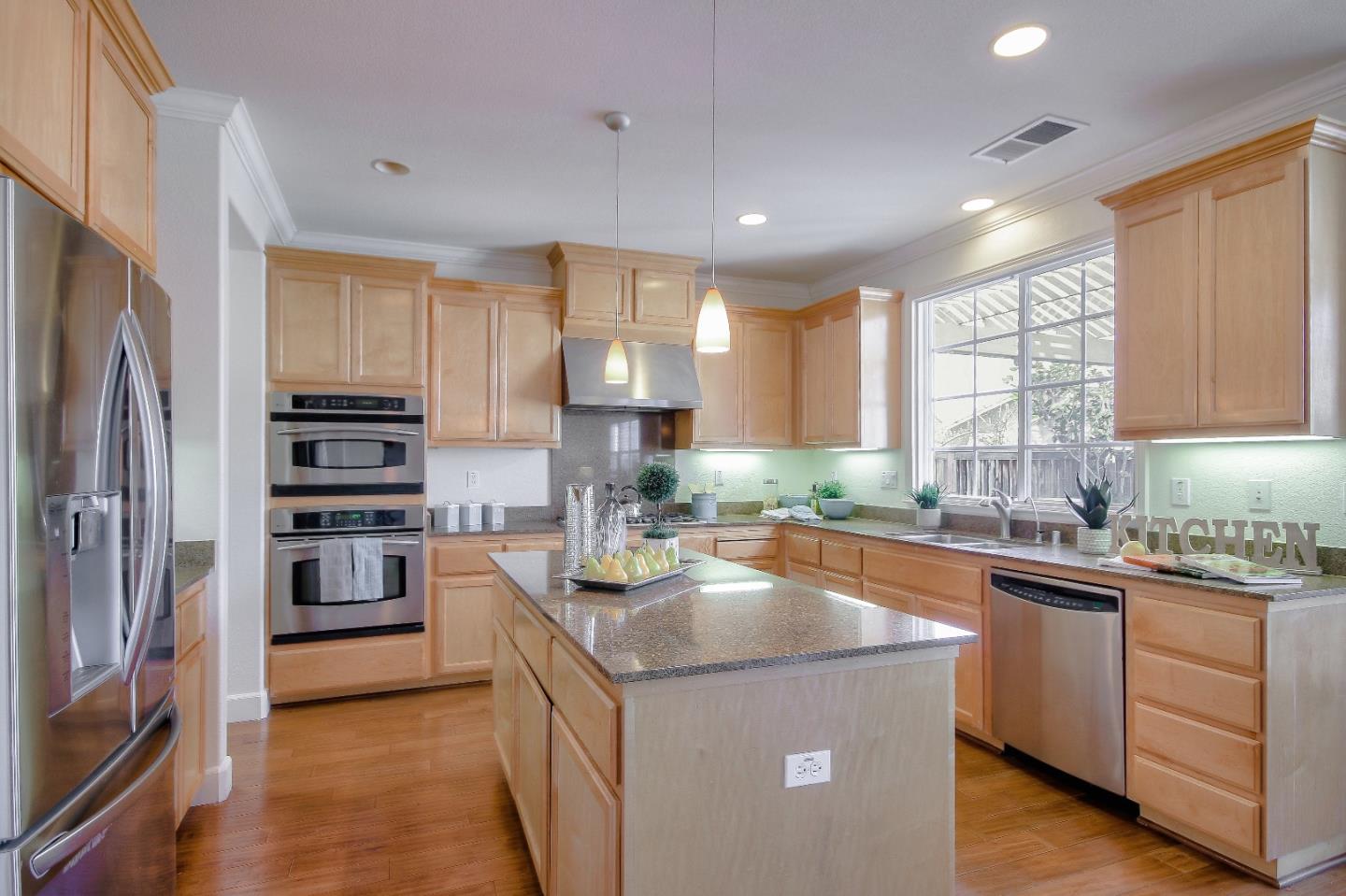 2893 Bethany Road San Ramon, CA 94582 - Photo 12 of 43 a kitchen with stainless steel appliances granite countertop a sink stove refrigerator and cabinets