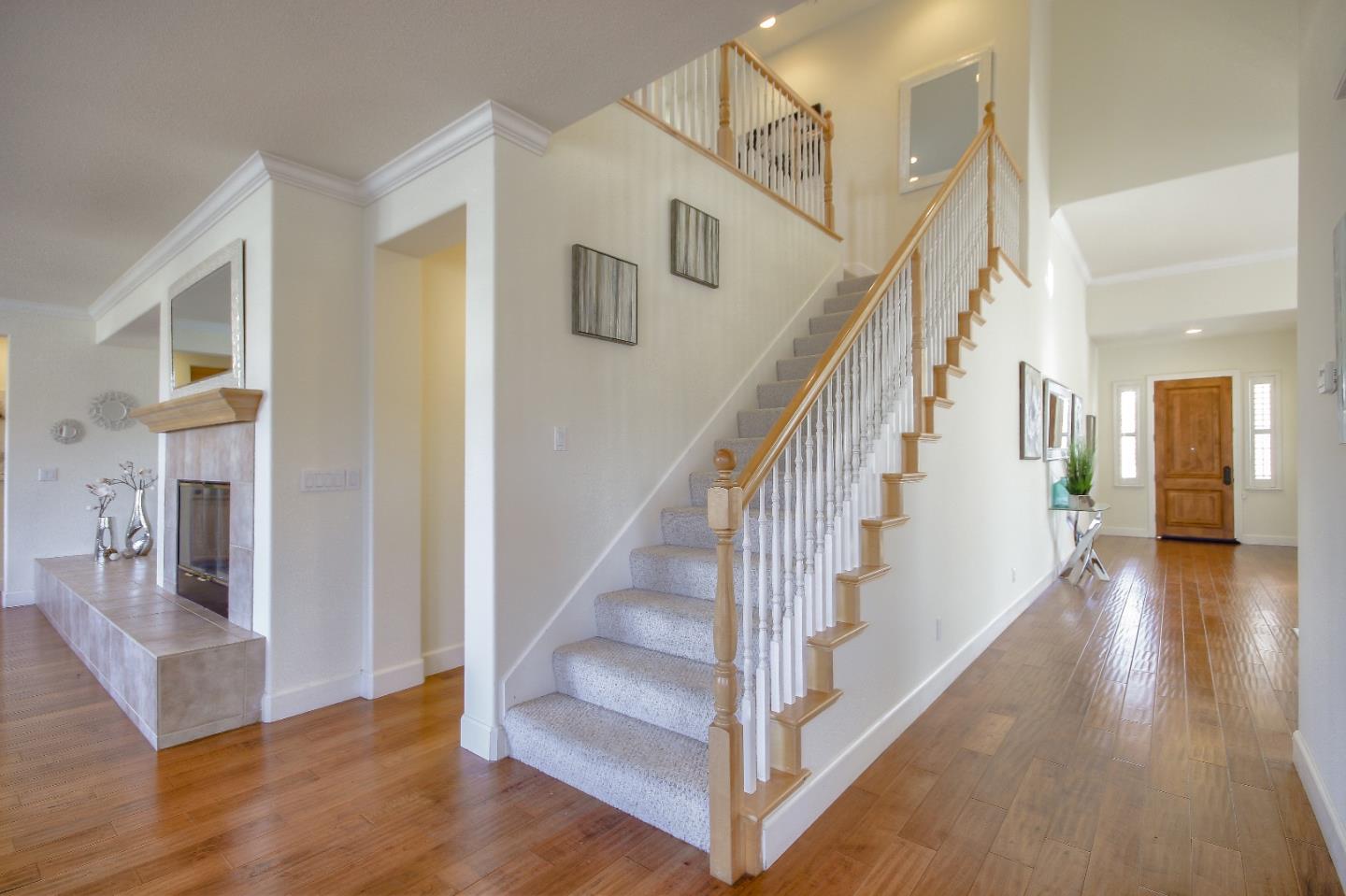 2893 Bethany Road San Ramon, CA 94582 - Photo 18 of 43 a view of staircase with lots of frames on wall and wooden floor