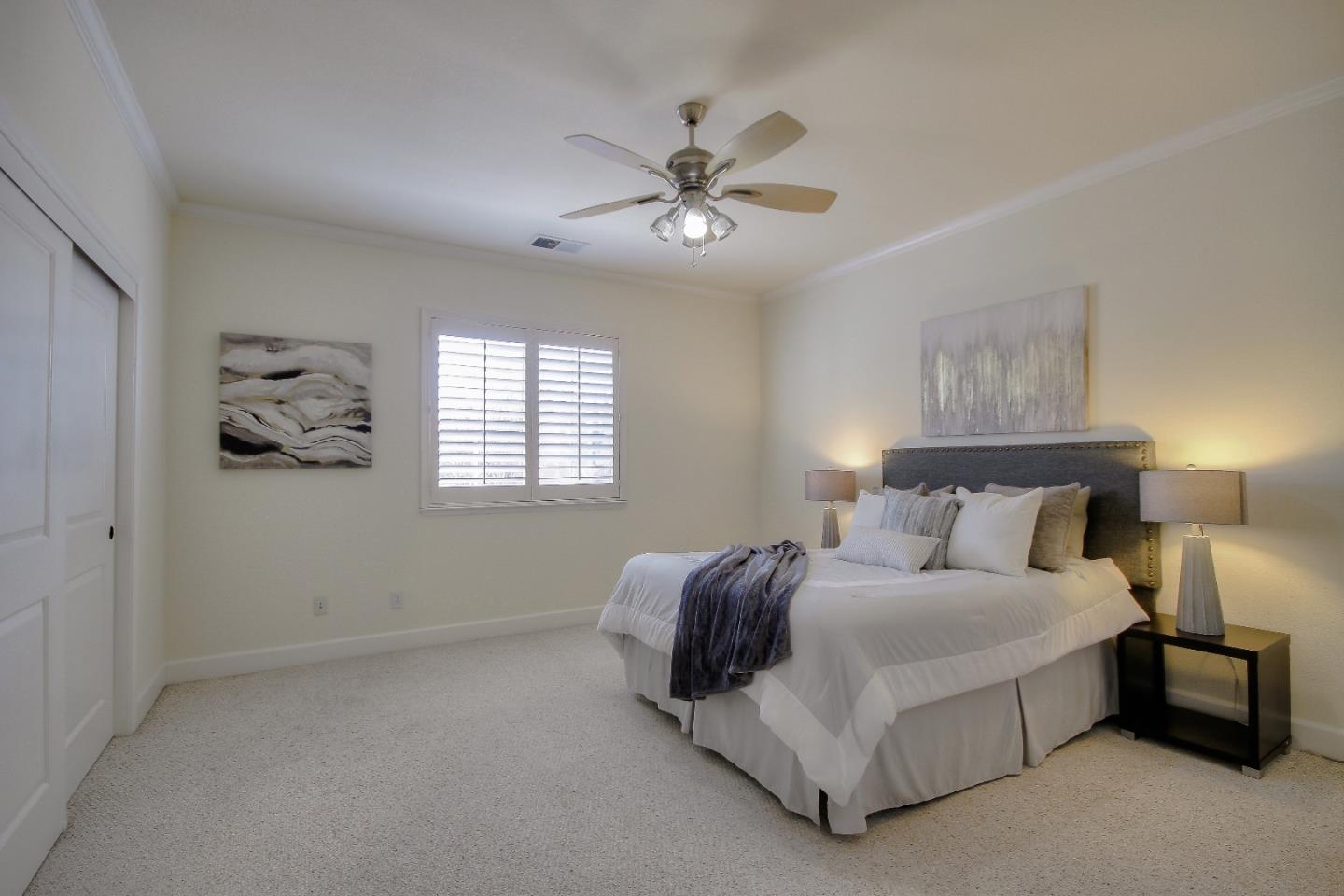 2893 Bethany Road San Ramon, CA 94582 - Photo 23 of 43 a bedroom with a bed and a chandelier