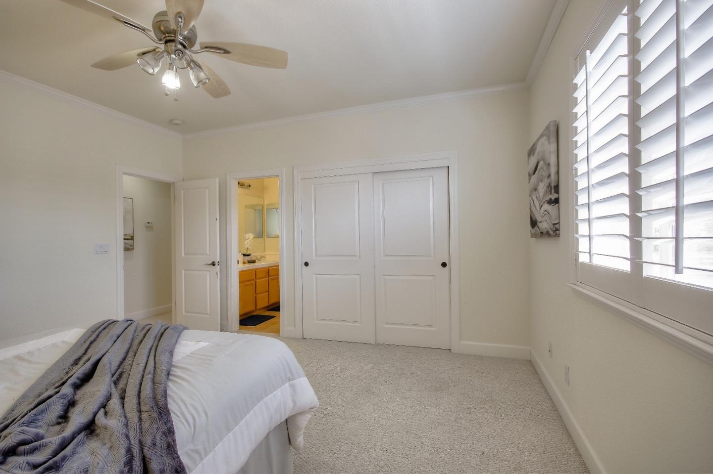 2893 Bethany Road San Ramon, CA 94582 - Photo 24 of 43 a bedroom with a bed and a chandelier