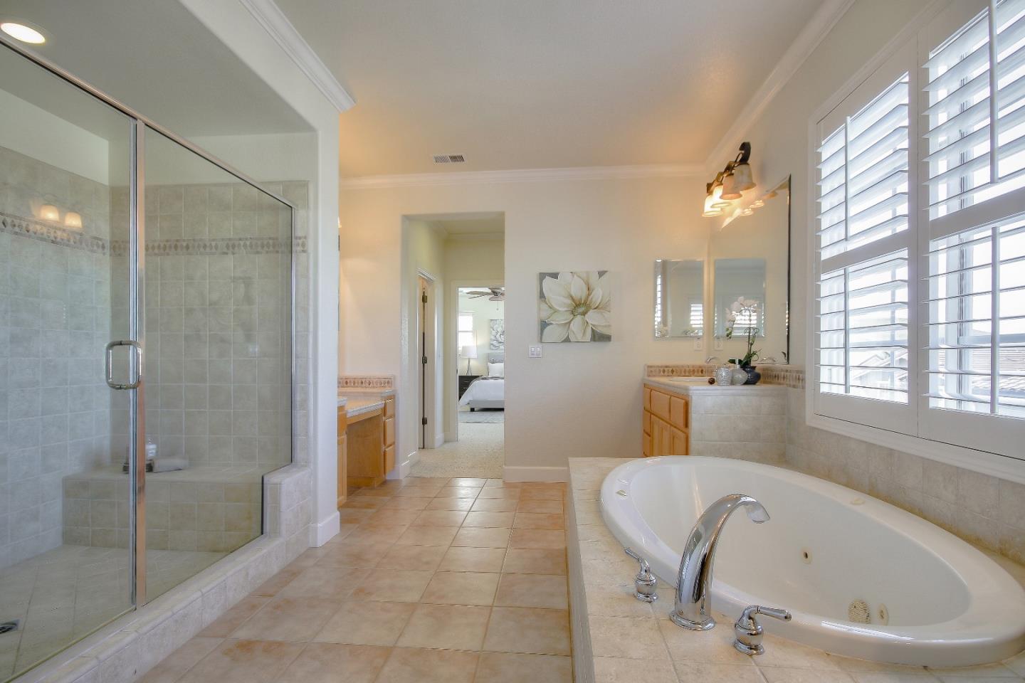 2893 Bethany Road San Ramon, CA 94582 - Photo 32 of 43 a bathroom with a bathtub and a shower