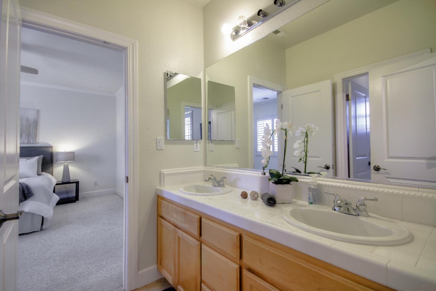 2893 Bethany Road San Ramon, CA 94582 - Photo 34 of 43 a bathroom with double sink and a mirror