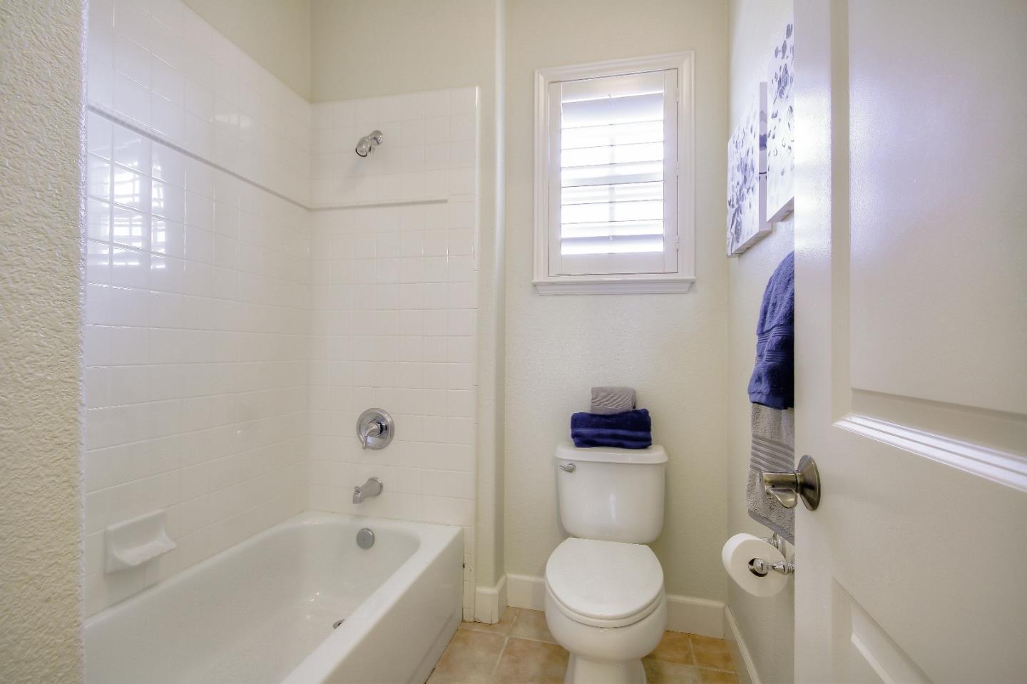 2893 Bethany Road San Ramon, CA 94582 - Photo 35 of 43 a white toilet sitting next to a bath tub shower
