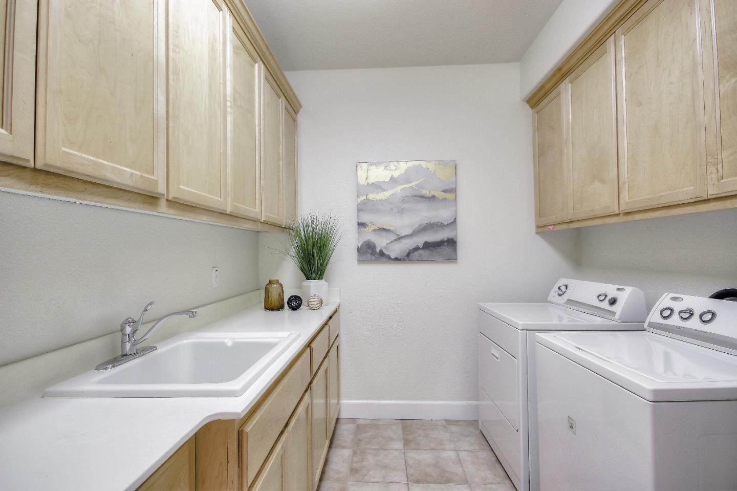 2893 Bethany Road San Ramon, CA 94582 - Photo 37 of 43 a kitchen with a sink cabinets and washing machine