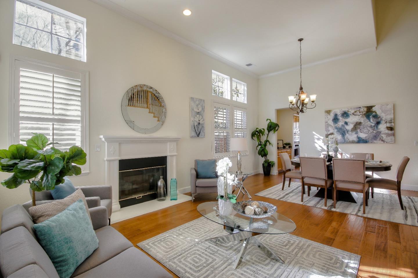 2893 Bethany Road San Ramon, CA 94582 - Photo 6 of 43 a living room with furniture a fireplace and a chandelier