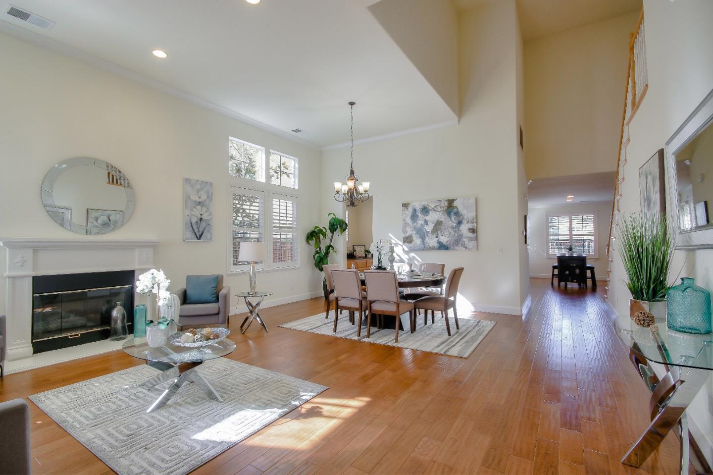 2893 Bethany Road San Ramon, CA 94582 - Photo 7 of 43 a living room with furniture dining table and a fireplace